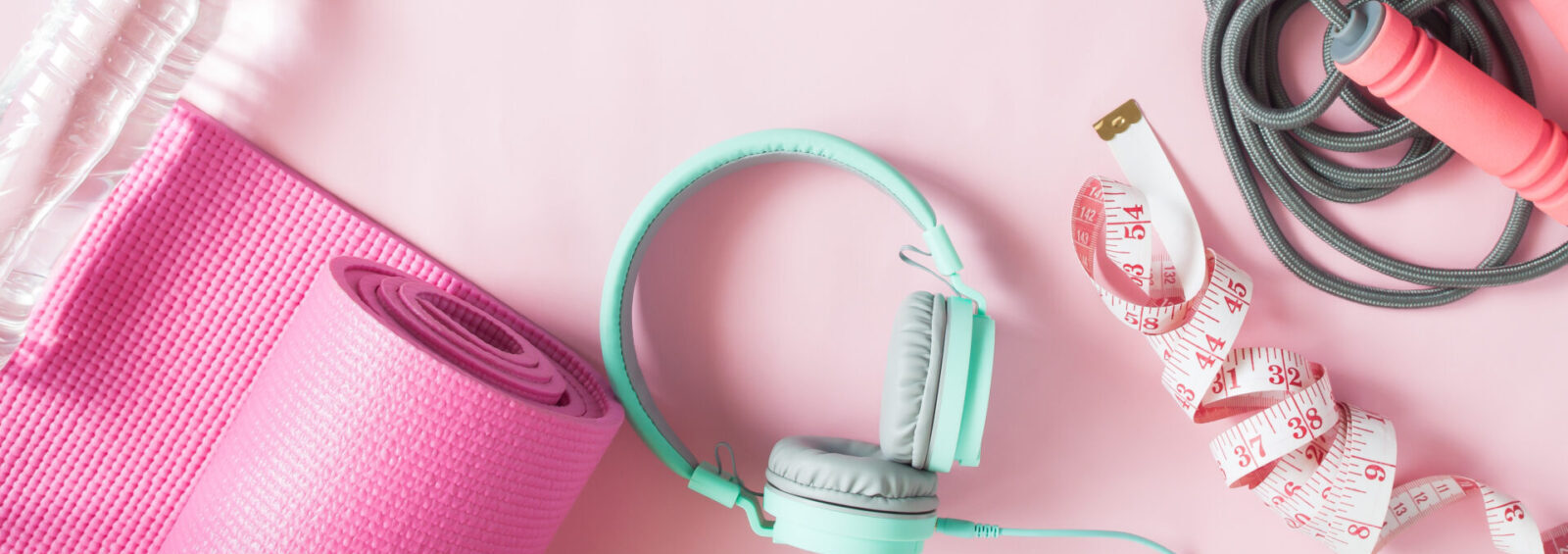 Healthy Flat Lay With Sport And Fitness Equipments And Mint Color Headphones On Pink Color Background