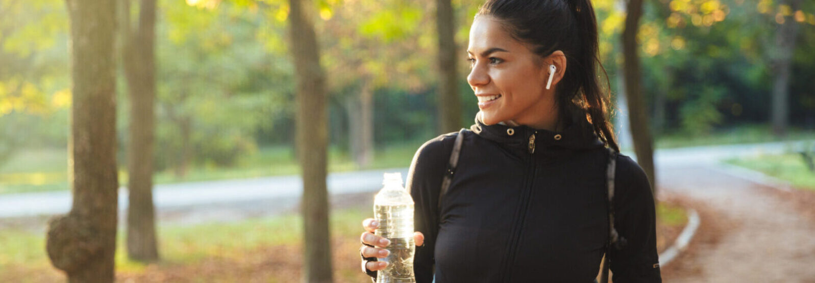 Attractive Fit Sportswoman With A Bicycle At The Park